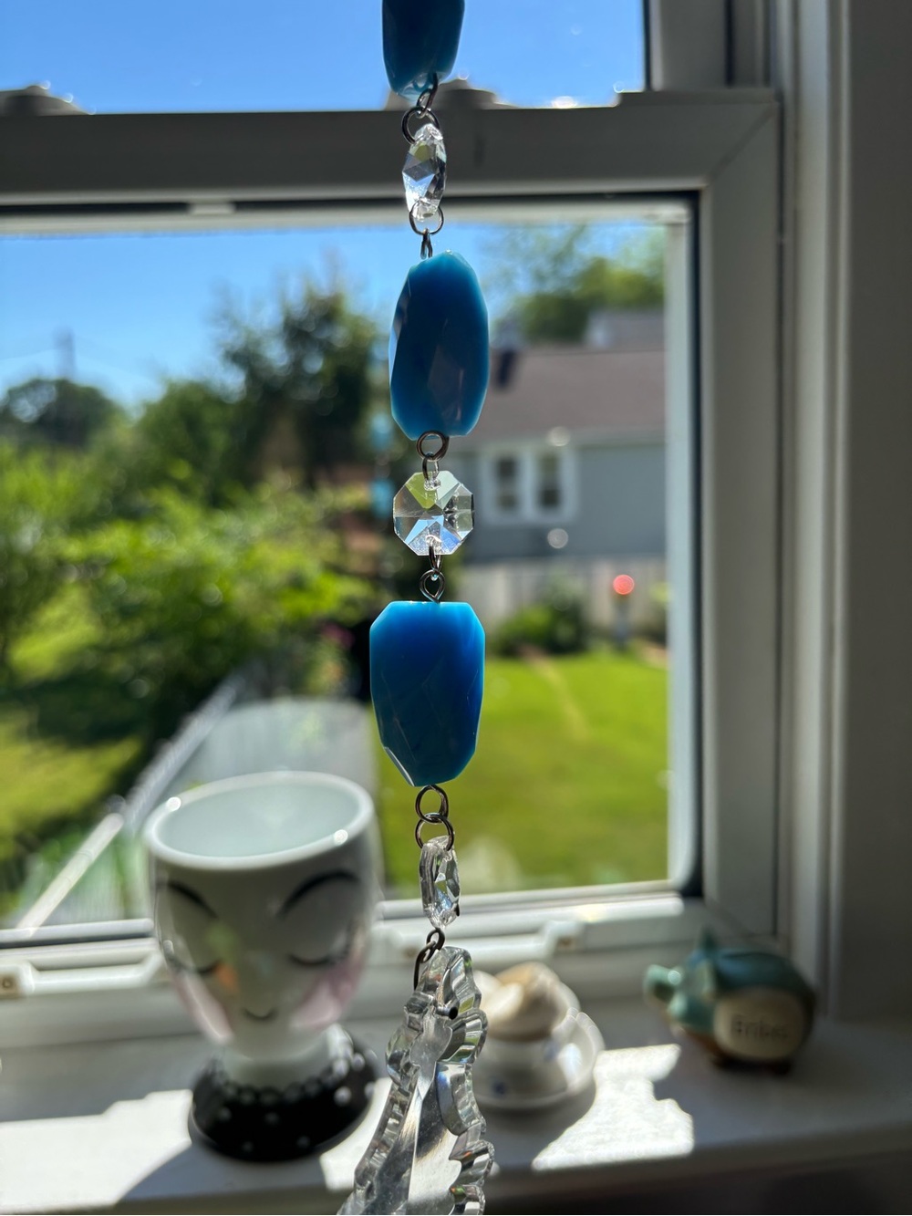 Hand Crafted Sun Catcher Blue and Clear Faceted Bead with Vintage Leaf Pendulum